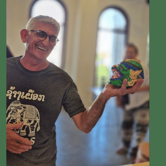 A person holding a colorful toy. 4