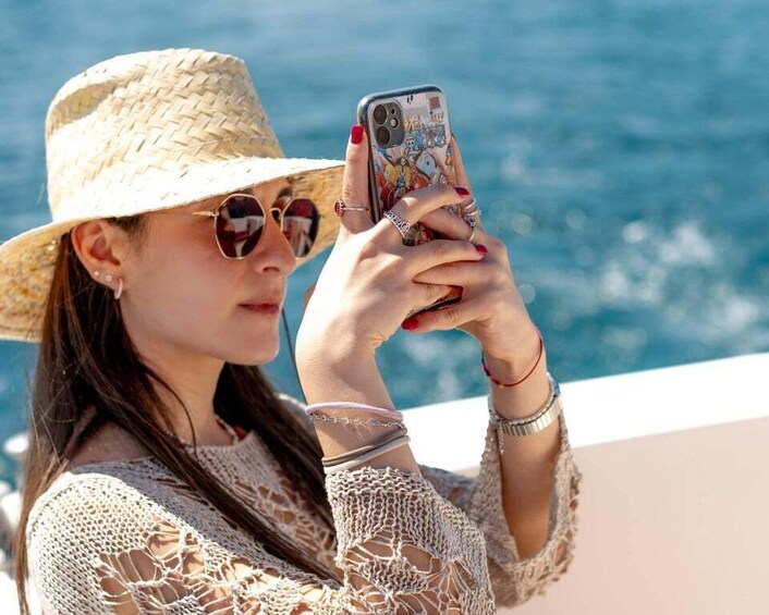 A person taking a photo with a smartphone. 5