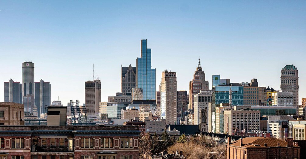 A city skyline with a mix of modern and historic buildings, including a prominent skyscraper. 2
