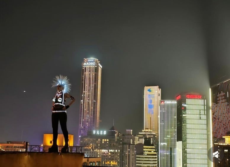 A person standing on a rooftop with a city skyline in the background. 5