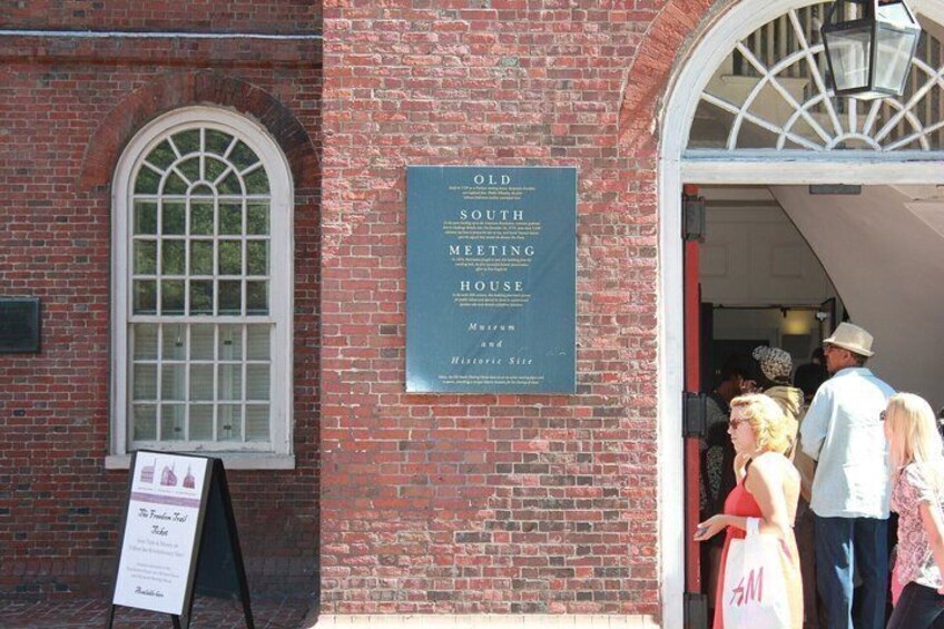 A brick building with a sign for the Old South Meeting House. 5