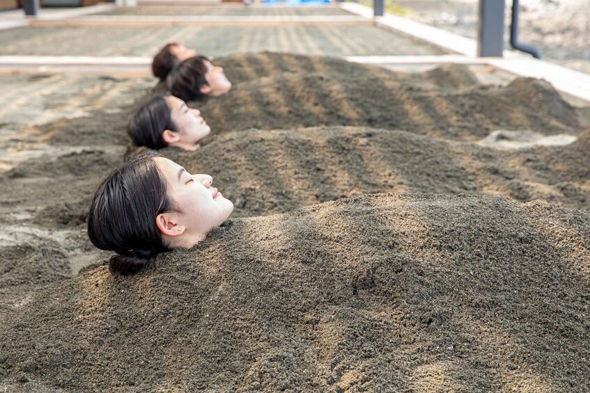 People lying on sand piles. 1