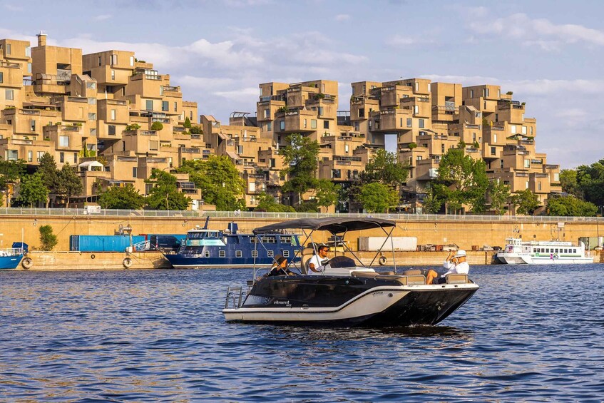 A boat on water with a cityscape in the background. 3