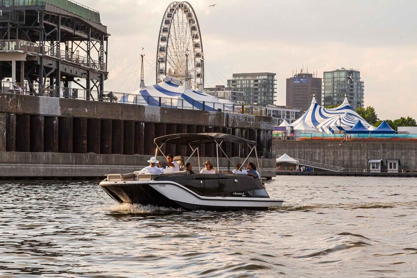 A boat with passengers on a river, a Ferris wheel, and a circus tent in the background. 1