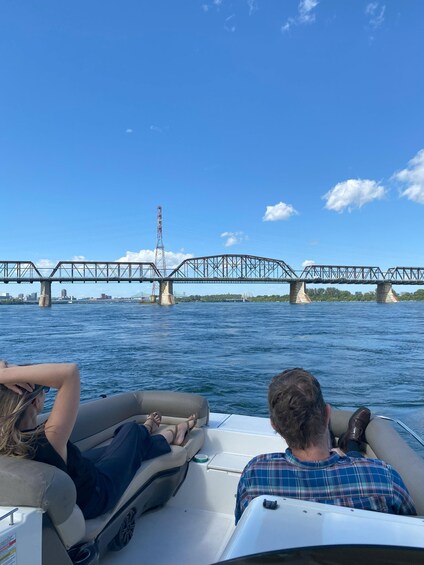 A boat on water with a bridge in the background. 5