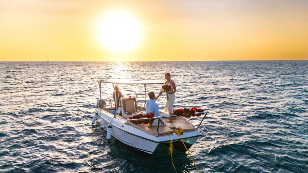 A boat on calm waters during sunset. 1
