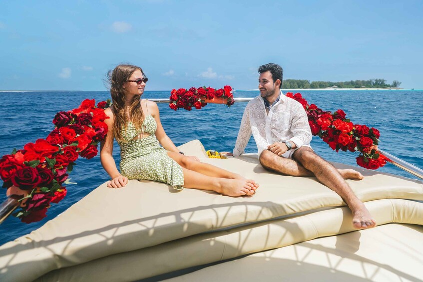 Two people on a boat with red roses. 5