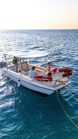 A boat with passengers on a calm sea. 4