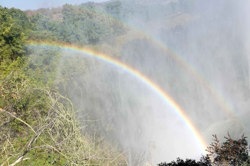 A waterfall with a rainbow. 4