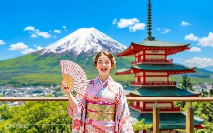 A person in traditional Japanese attire holding a fan, with a pagoda and Mount Fuji in the background. 2