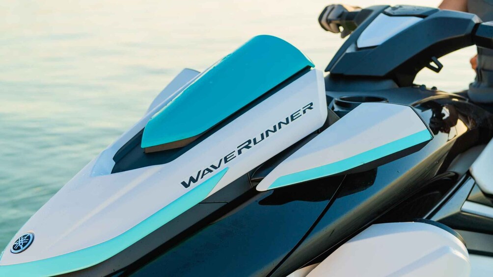 A Yamaha Waverunner jet ski with teal and white color scheme. 3