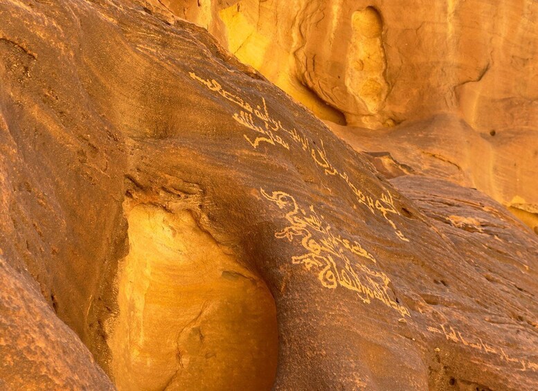 A rock formation with ancient carvings. 4