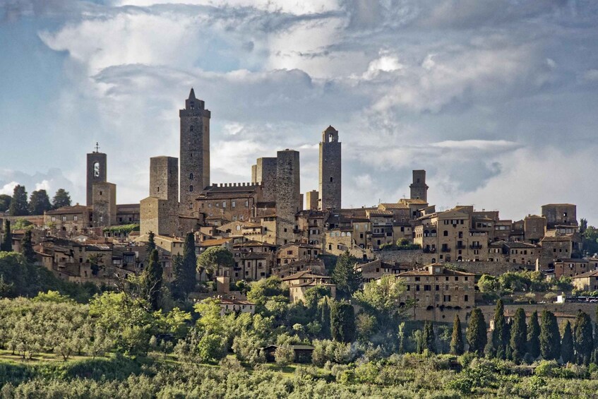 A historic town with medieval architecture, including towers and a prominent church. 1