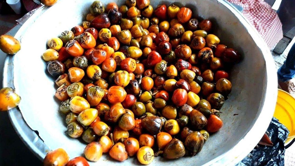 A large bowl filled with various roasted nuts. 5