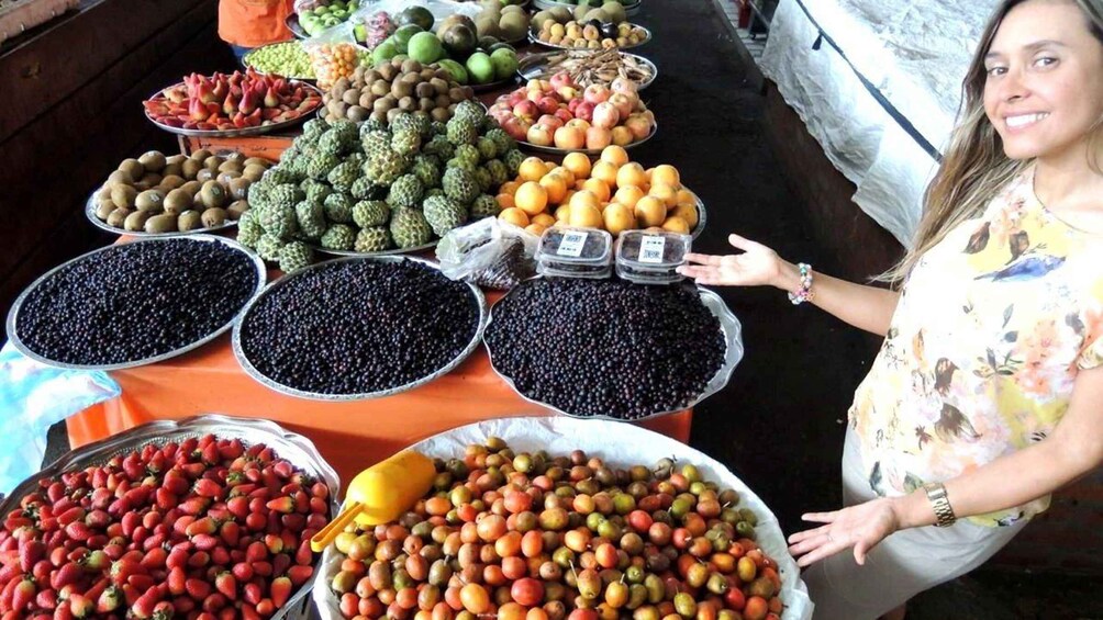 A variety of fruits and vegetables displayed at a market stall. 1