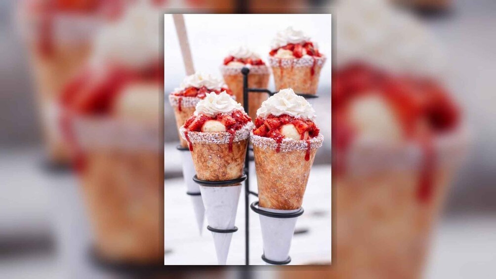 Ice cream cones with whipped cream and strawberries. 5