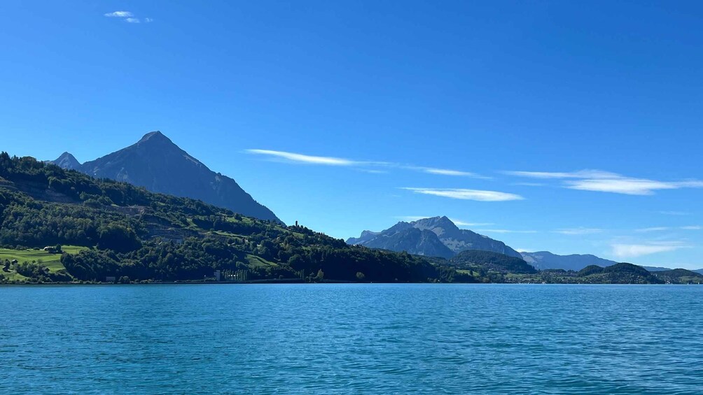 A calm lake with mountains in the background. 4