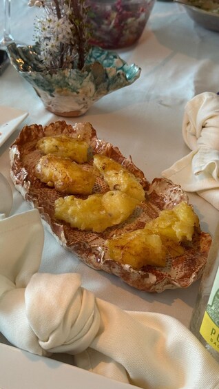 A slice of toast with butter and pineapple chunks on a plate. 2