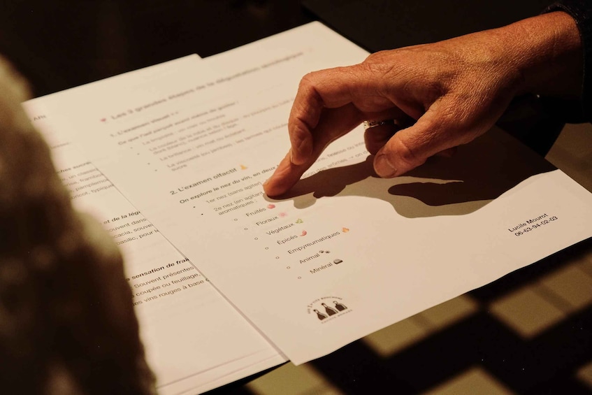 A person reading a menu with various food items listed. 3