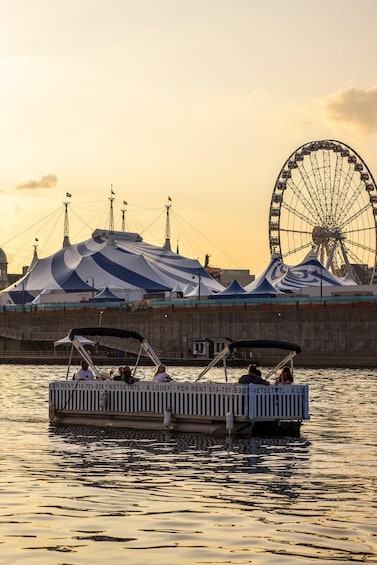 A Ferris wheel, tents, and a boat with people on it. 4