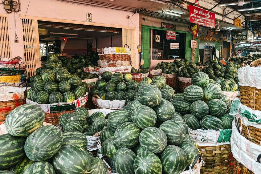 A market stall with large watermelons. 3