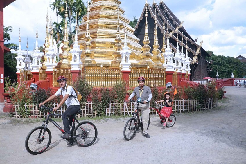 A temple with golden spires and a red-roofed structure. 3