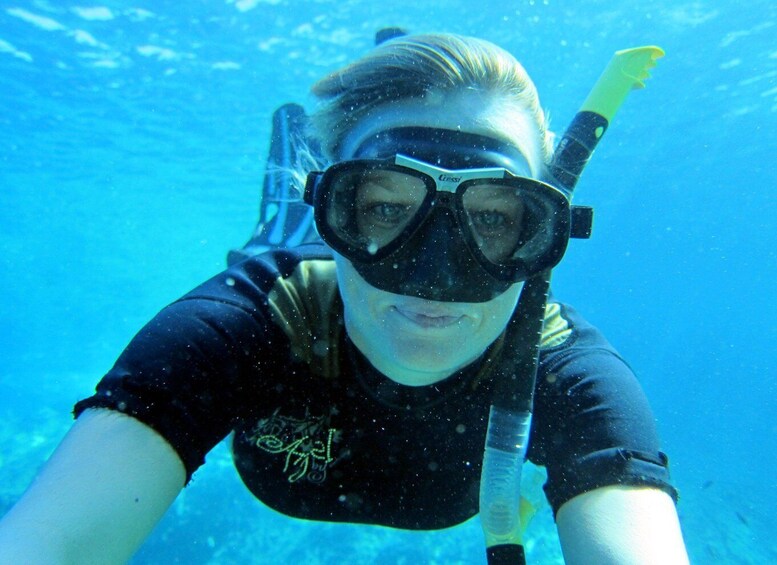 A person scuba diving underwater. 3