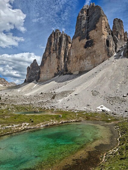 A mountain landscape with a clear lake and rocky peaks. 3