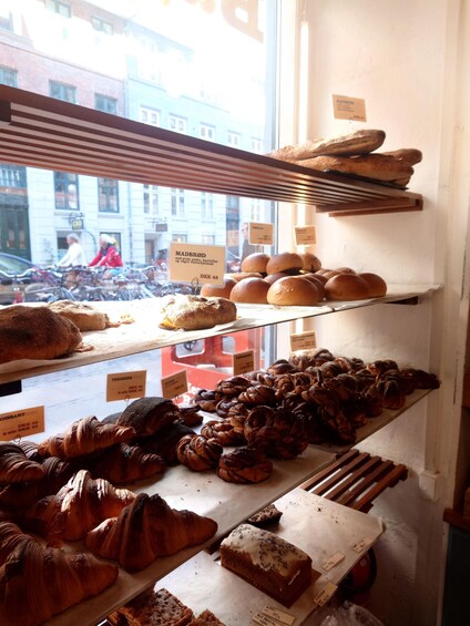 A bakery display with various baked goods. 3