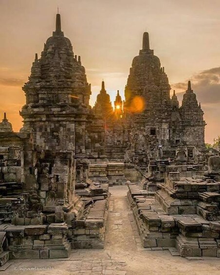 An ancient temple complex with multiple structures and a central pathway. 2