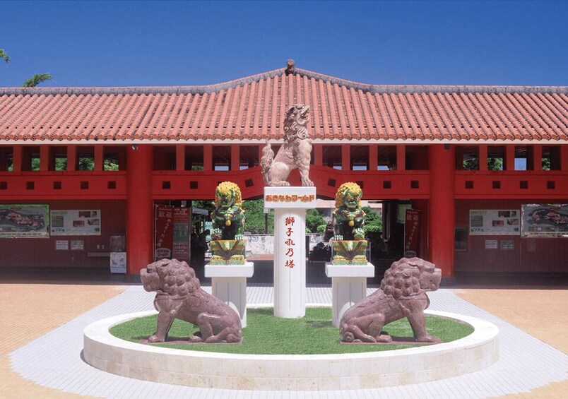 A traditional building with a red roof and a statue of a lion in the center. 3