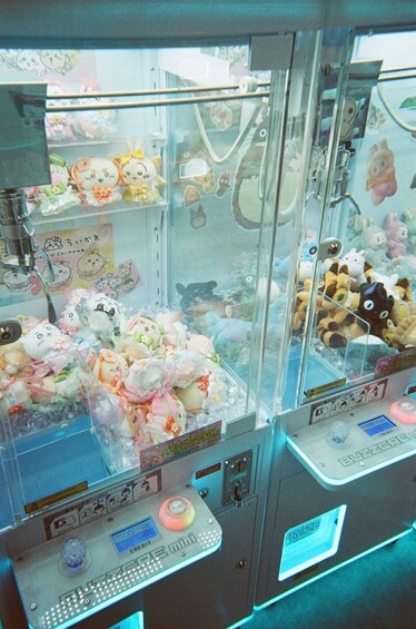 A claw machine filled with plush toys. 1