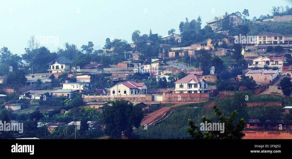 A hillside settlement with houses and greenery. 5