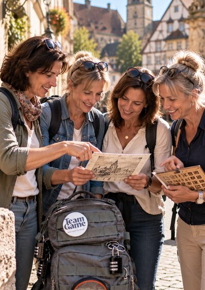 A group of people examining a map outdoors, with historical buildings in the background. 2