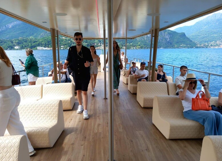 A cruise ship deck with passengers seated and walking. 4