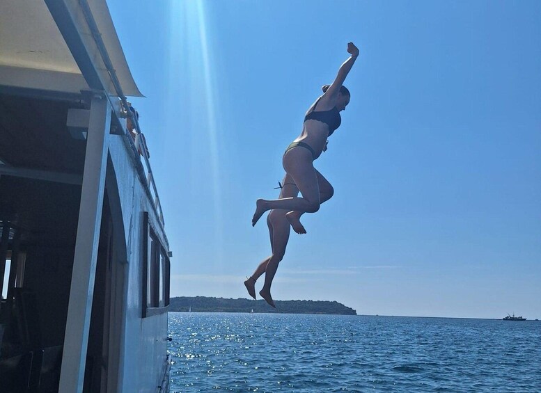 A person jumping off a boat into the sea. 2
