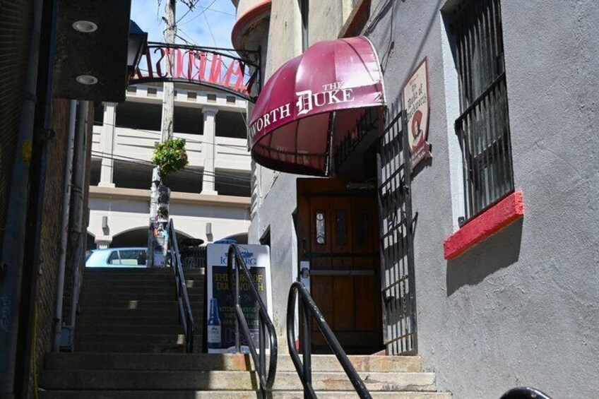 A staircase leading to a building with a red awning labeled 'The North Face.' 3