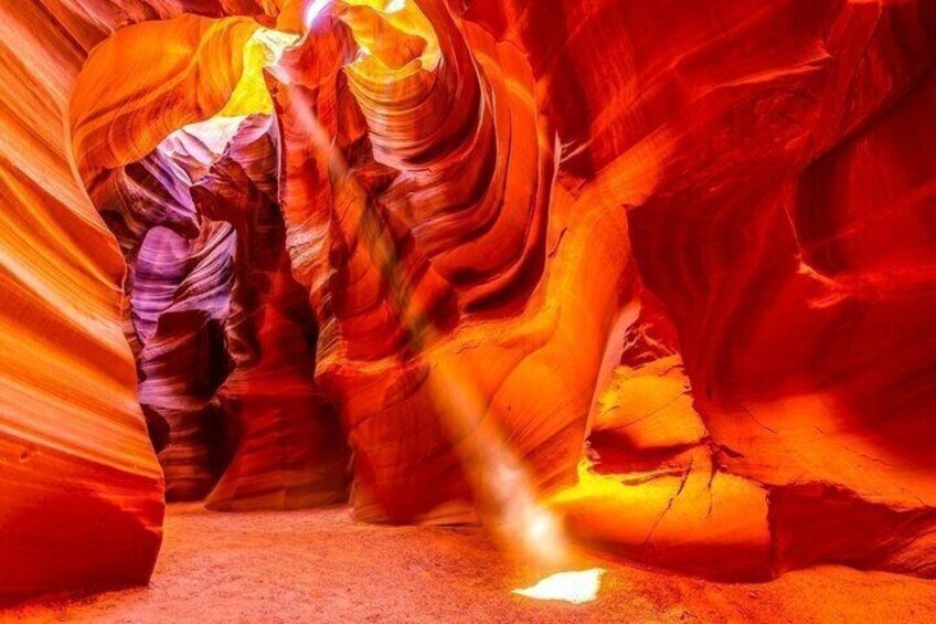 A canyon with red and orange rock formations. 1