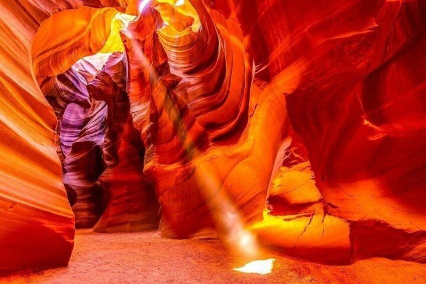 A canyon with red and orange rock formations. 1