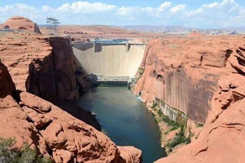 A dam with a reservoir in a canyon. 2