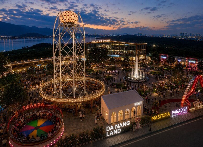 A vibrant evening scene at a theme park with a Ferris wheel, a water tower, and various illuminated structures. 1