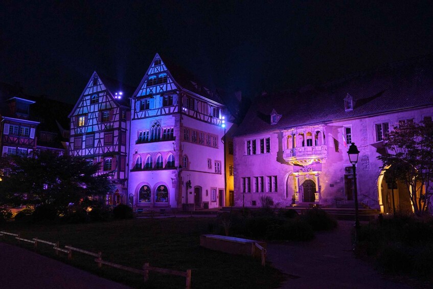A historic building with illuminated facades and traditional architecture. 1