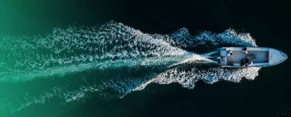 A boat creating a wake in the water. 5