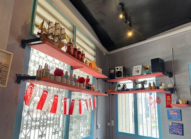 A room with multiple shelves displaying various items, including a ship model, bottles, and flags. 3