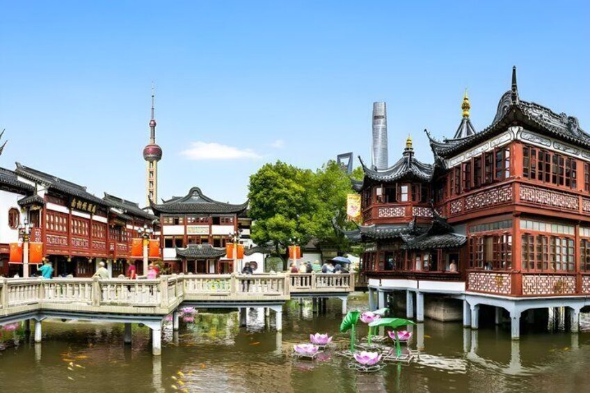 Traditional Chinese architecture, a waterway, and a modern tower. 5