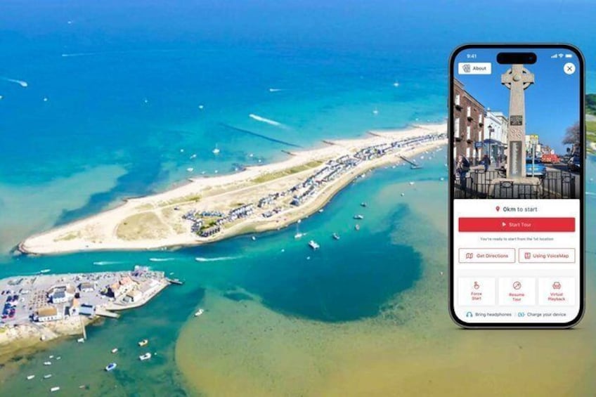 An aerial view of a coastal area with a long stretch of beach, boats, and a pier. 1