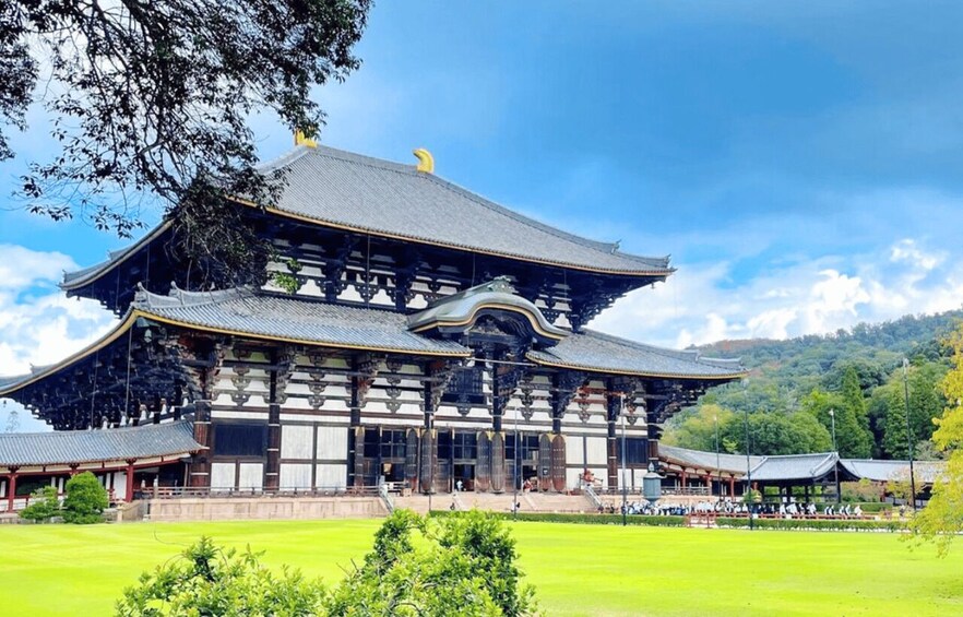 A traditional Japanese building with a curved roof and wooden pillars. 4