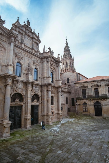 A historic building with ornate architecture and a courtyard. 3