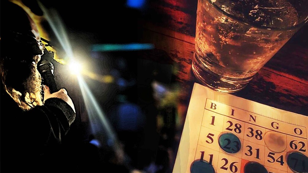 A dice, a glass of amber liquid, and a bingo card. 1