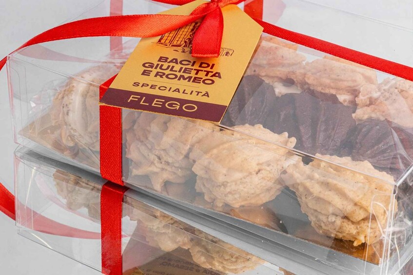 A packaged food item with a red ribbon and a label that reads 'Baci di Giulietta e Romeo Specialità Fleggo.' 3